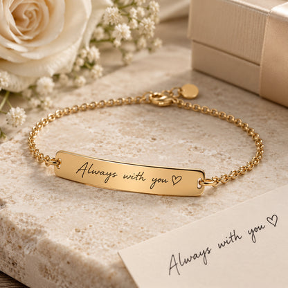 Handwriting engraving on a gold bracelet